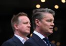 Victorian Premier Ben Carroll speaks at a press conference beside Police Minister Paul Edbrooke