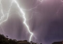 Massive lightning bolt in a dark sky, spread out like a web.